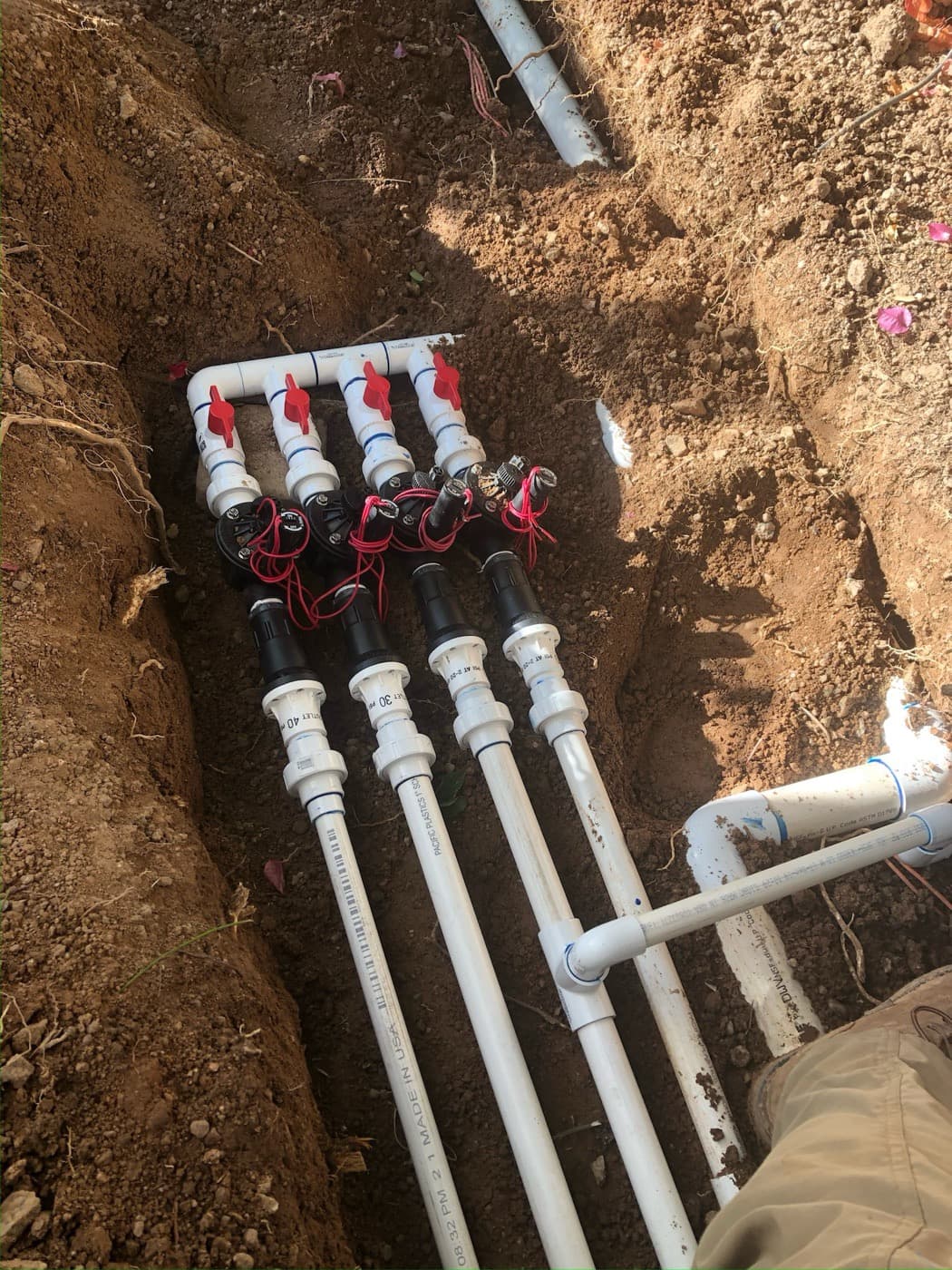 New irrigation valve manifold installed in a trench